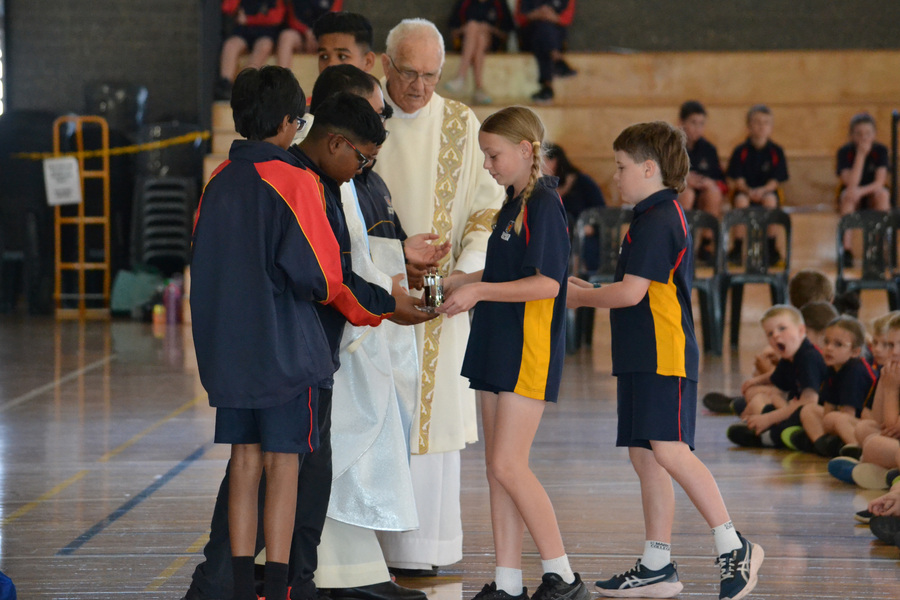 FEAST DAY > Delta and Ted brought up the offertory.