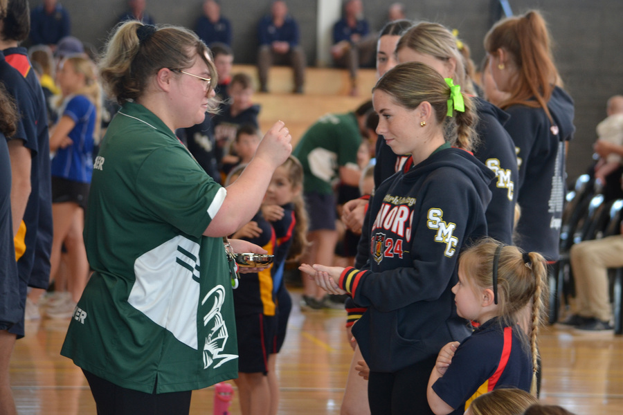 FEAST DAY > Sophie receives Communion from Miss Bennier.