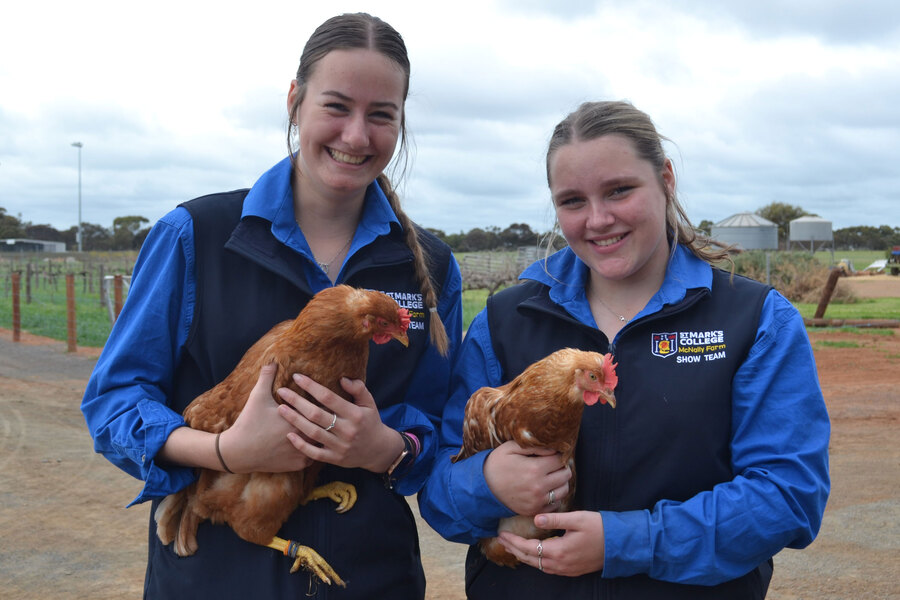 ADELAIDE SHOW > Chloe and Jess with two of the Show chickens.