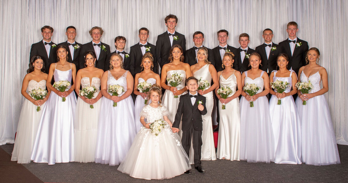 The 2024 Blessing of the Fleet Debutantes and their partners, along with Miley and Bentley who were Flower Girl and Page Boy.