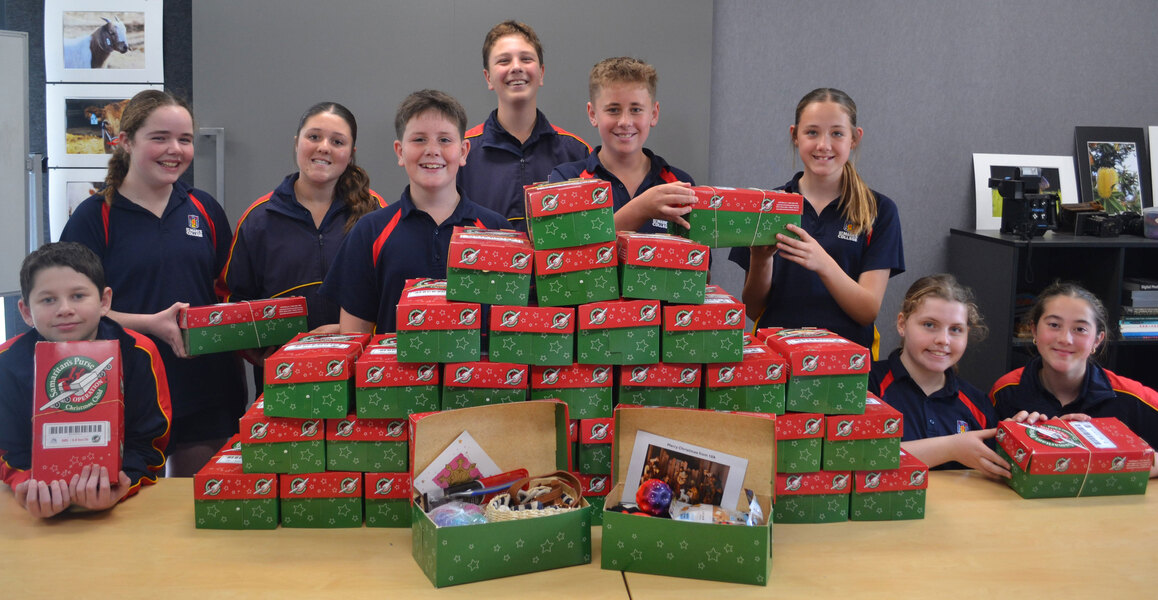 Year 7 students with the Operation Chistmas Child gift boxes filled with donated items from our College families.