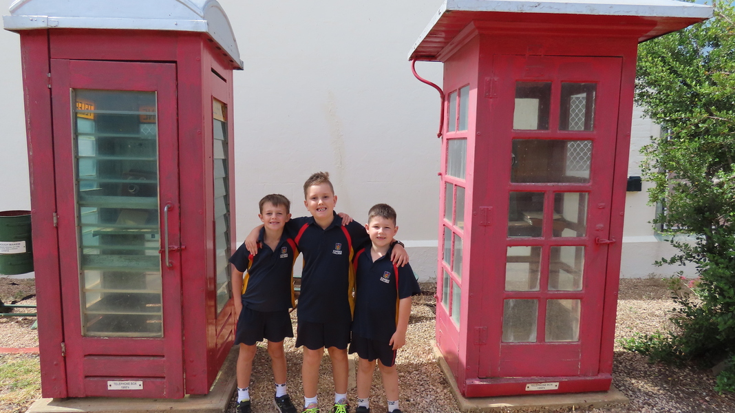 EXCURSION > Tanner, Jay and Dustin exploring the old-style telephone boxes.