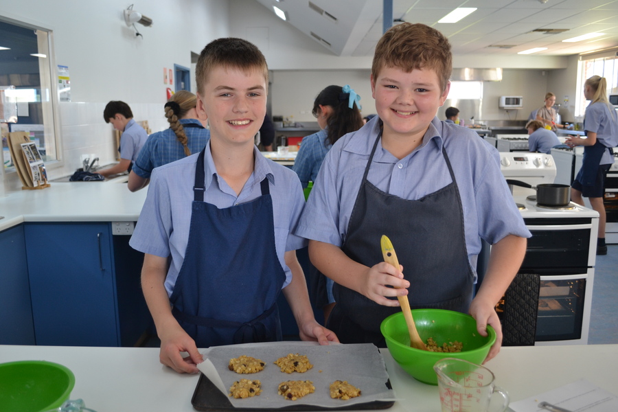 HOME EC > Year 7 students Dane and Malakai making muesli cookies in Home Ec.