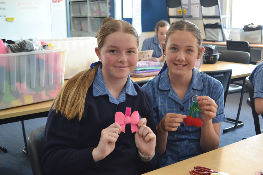 HOME EC > Year 7 students Jaylea and Skyla making emoji keyrings in Textiles.