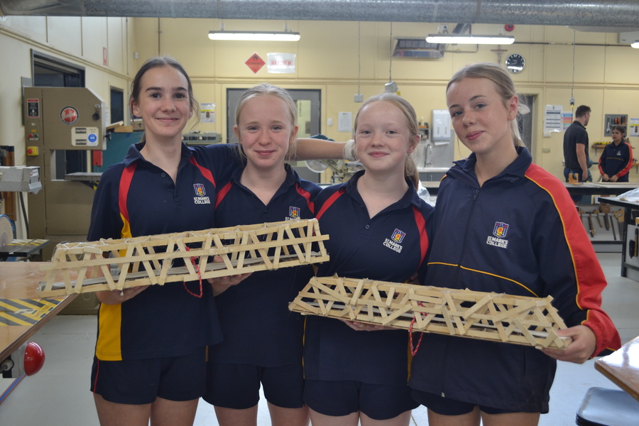 DESIGN + TECHNOLOGY > Year 7 students constructed bridges and tested their strength with weights, the strongest bridge holding 61kg!