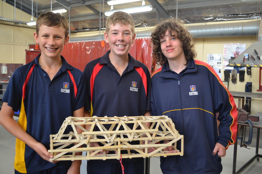 DESIGN + TECHNOLOGY > Year 7 students constructed bridges and tested their strength with weights, the strongest bridge holding 61kg!