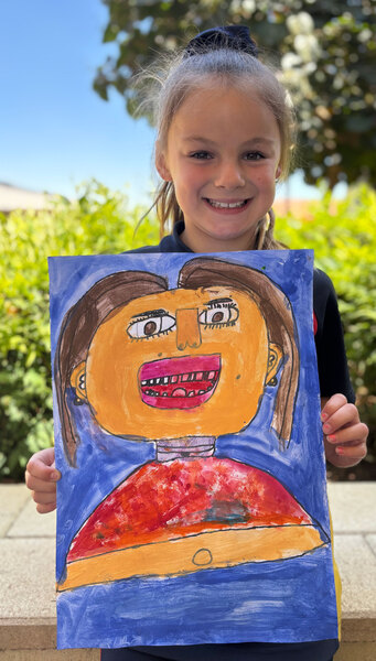 ART > Year 2 student Indi with her self portrait.