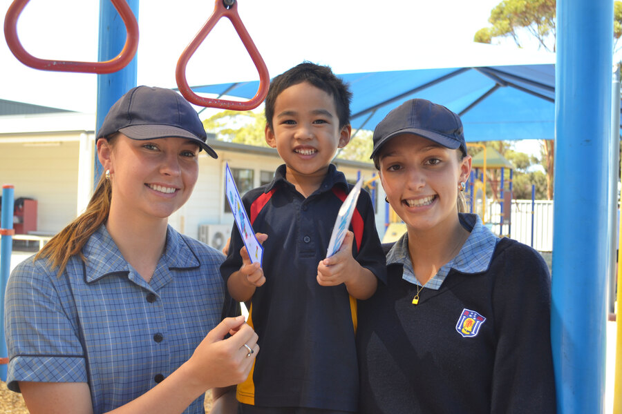 BUDDIES > Our Year 12s enjoyed meeting their Reception Buddies. Pictured is Keeley, Neville, and Danielle.