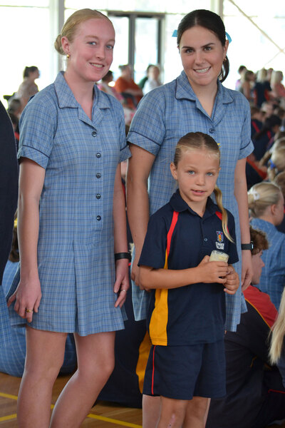 MASS > Lucy, Aliza and their buddy Hallie waiting to have their candle blessed.