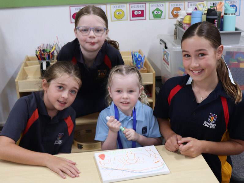 LITTLE LIONS > Year 5 students Willow, Jade and Lottie with their Little Lions Buddy Aubree.