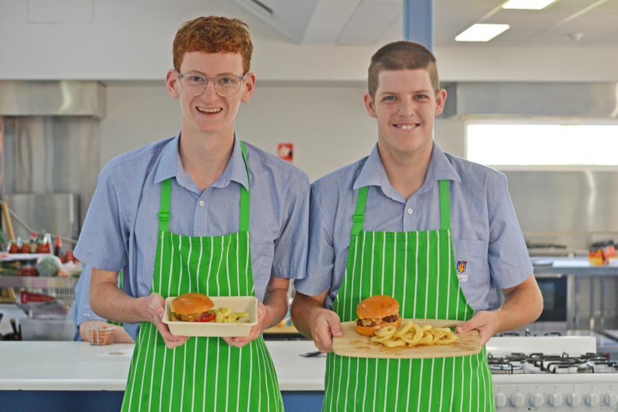 FOOD + HOSPITALITY > James and Austin with their custom burgers.